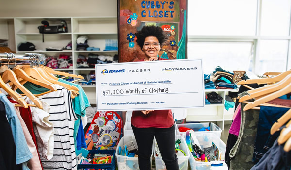 Cubby's Closet receives a large donation check.