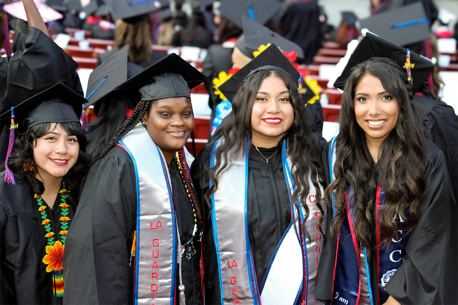 4 female college students at graduation